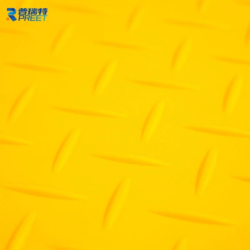 Anti-slip GRP grating installed on industrial floor to ensure worker safety Anti-slip GRP grating installed on industrial floor to ensure worker safety